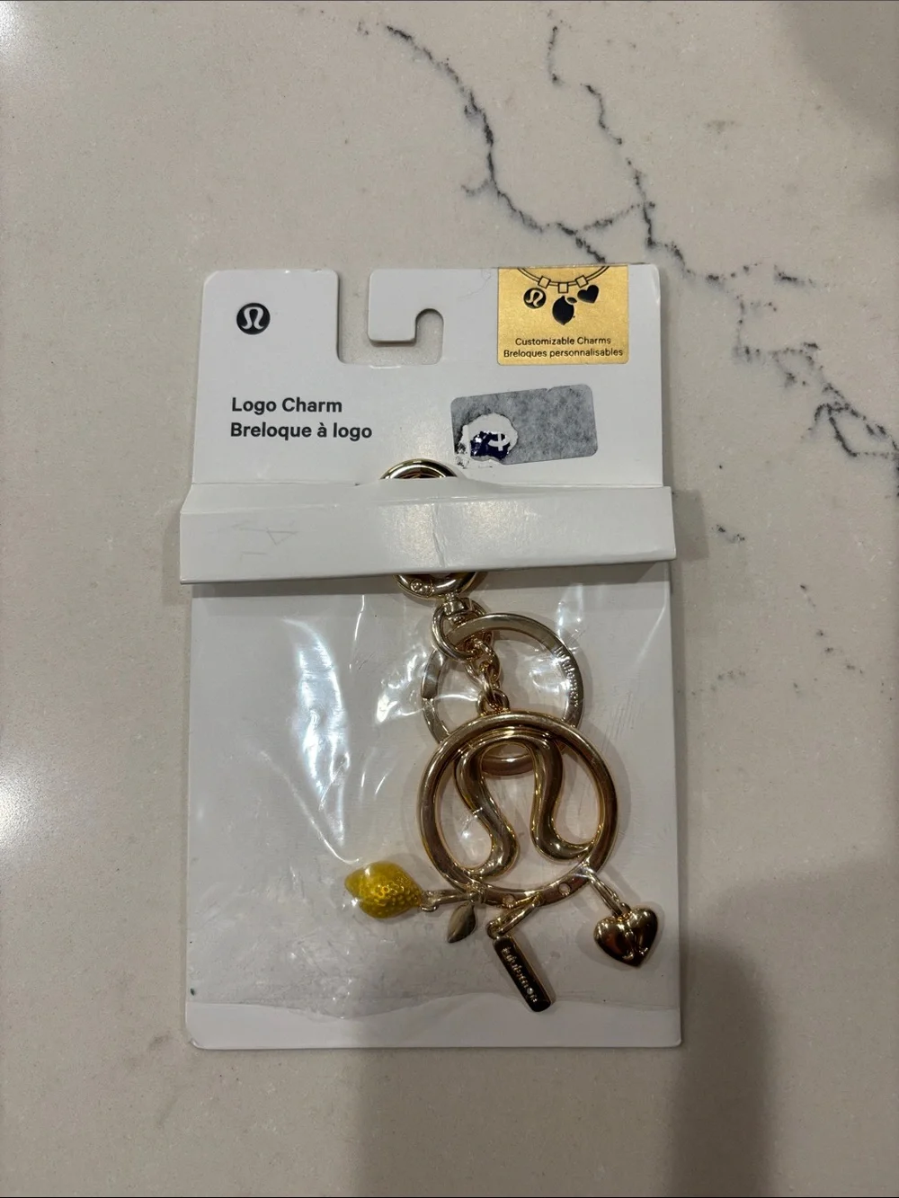 lululemon from Australia RARE Gold Logo 3 Charm Set NWT